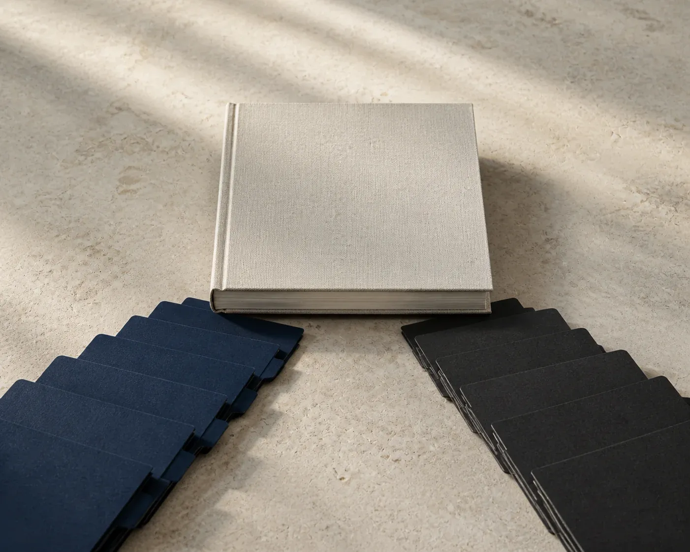 Blue and charcoal index tabs converging on a blank ivory ledger